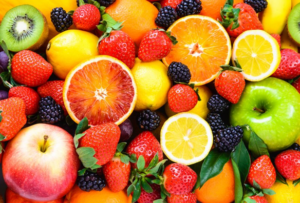 Brightly colored fruit like blackberries and lemons